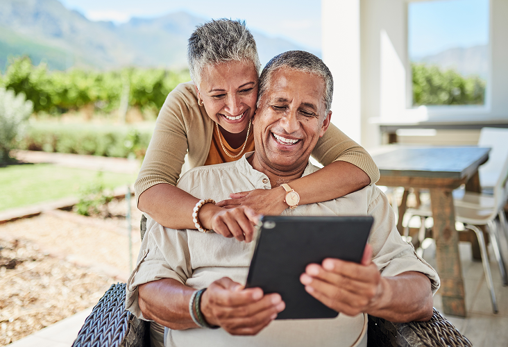A couple reviewing an eDocument on their tablet.