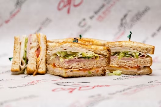 Turkey, ham, bacon, marble jack, provolone, lettuce, tomatoes, mayo & honey mustard, layered on three slices of our grilled wheat berry bread
