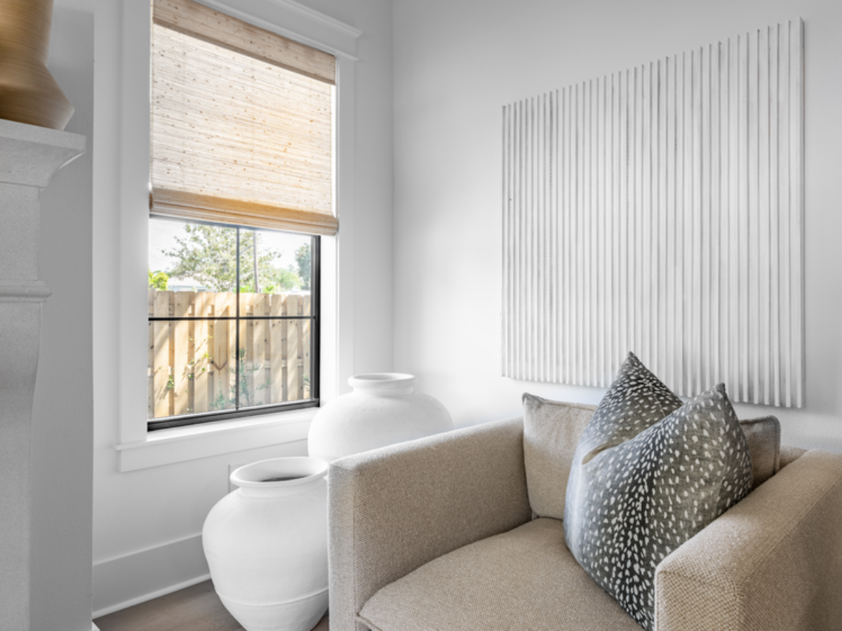 Woven Wood Shades bring warmth and natural texture to this cozy corner, softly filtering light while adding an organic touch to the space.