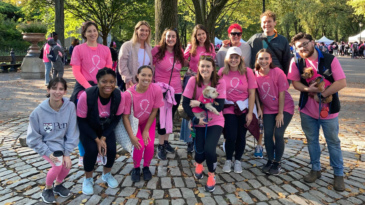 A large group of Yexters smiling at a volunteering event.