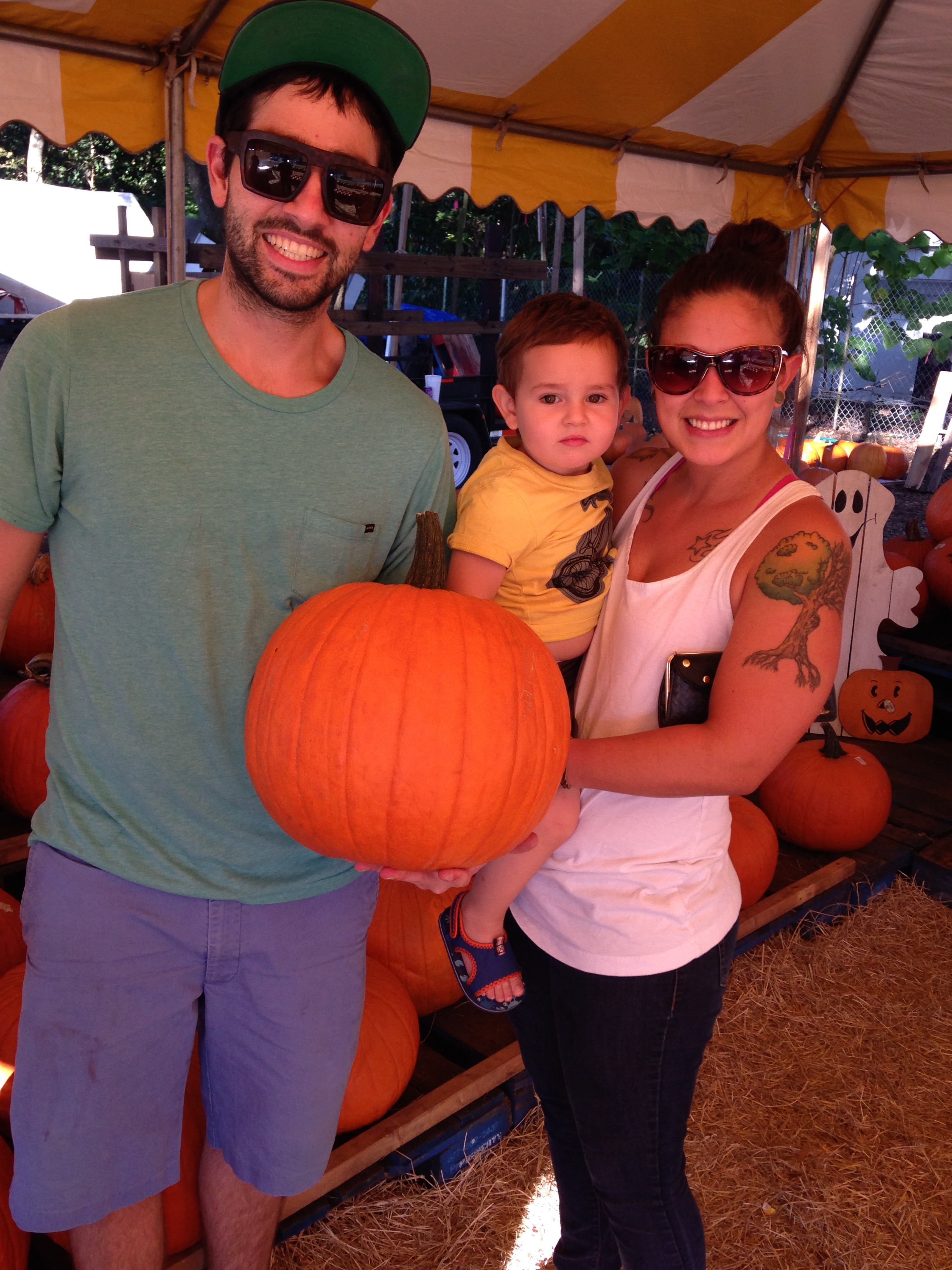 Nice- young -family- with- there- pumpkins