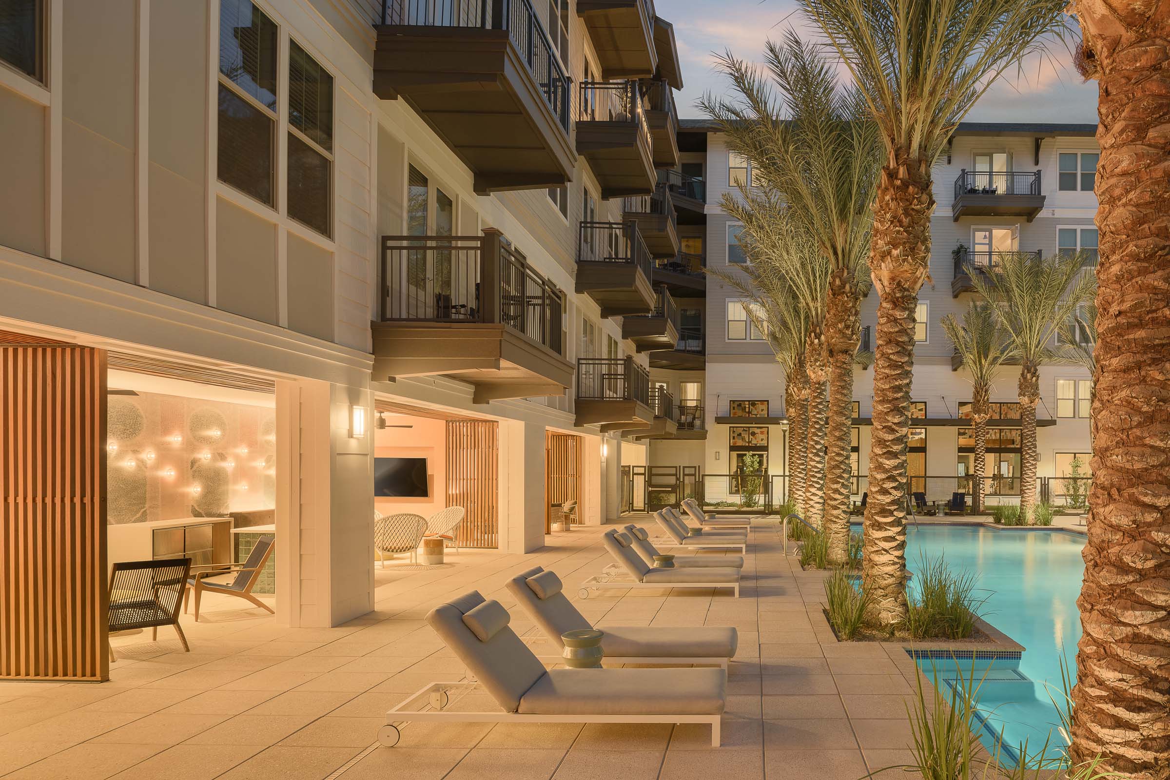 Poolside covered cabana lounge spaces at Camden Gilbert apartment homes in Gilbert, AZ