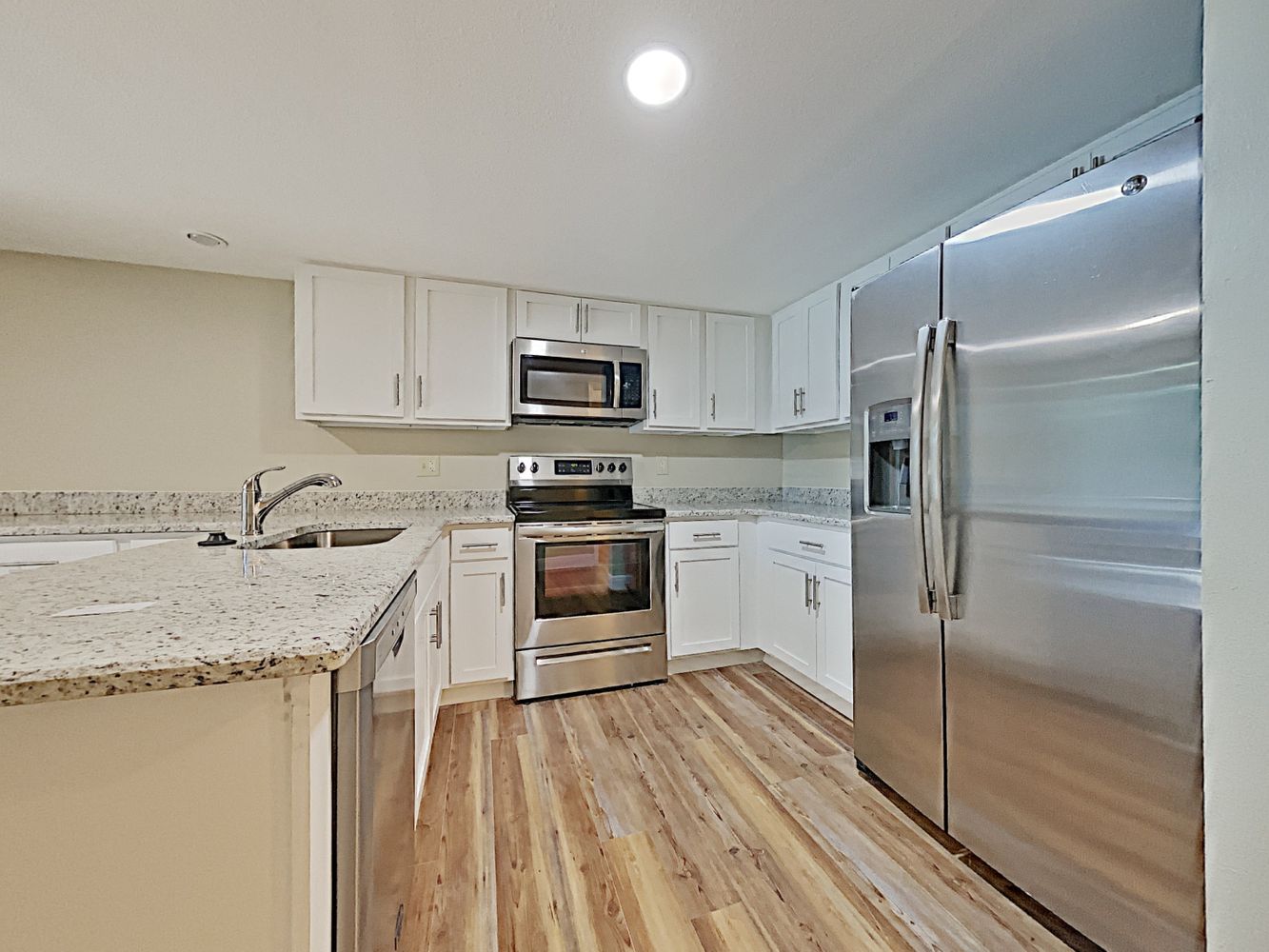 Gorgeous modern kitchen with stainless steel appliances at Invitation Homes Orlando.