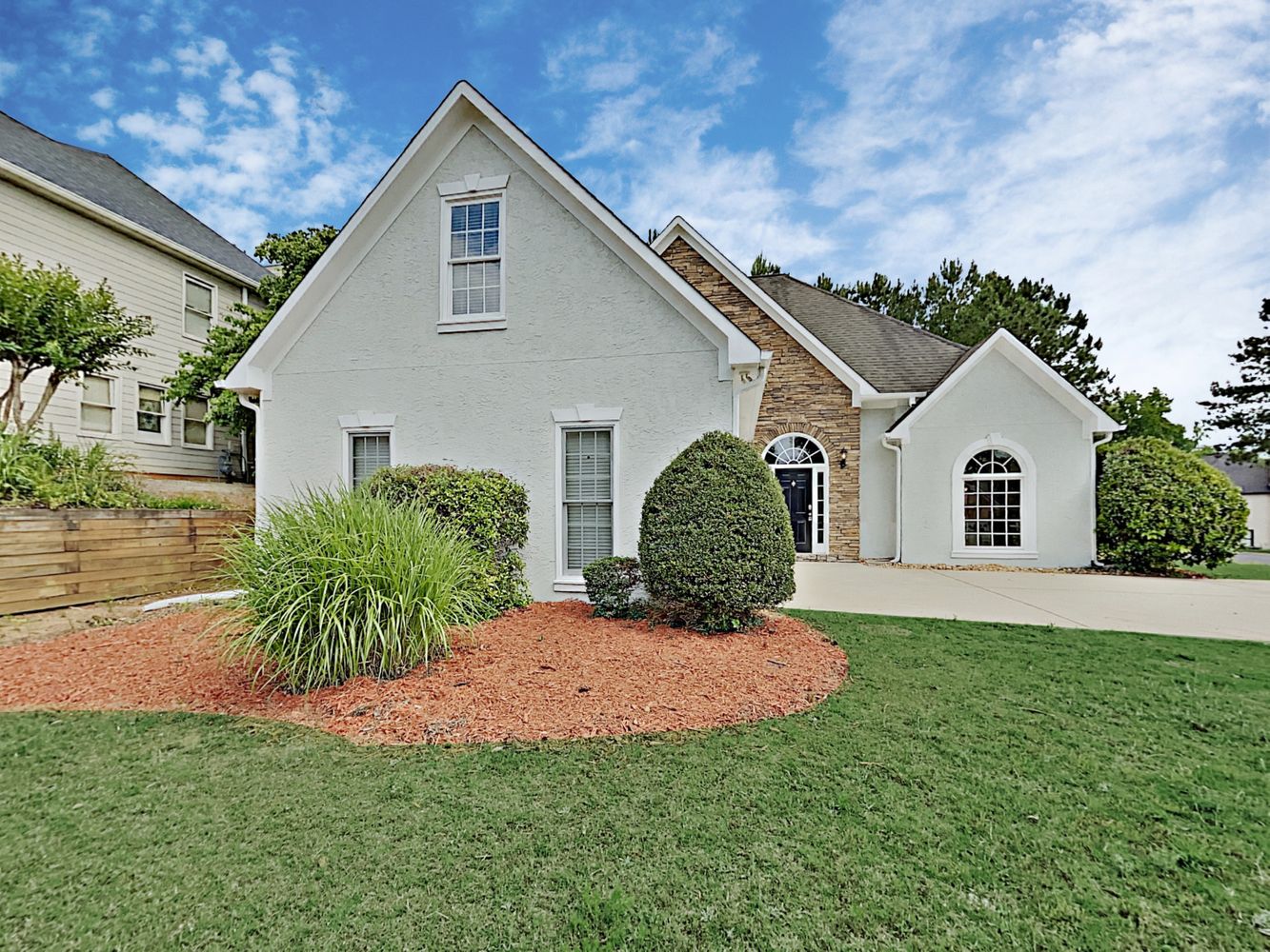 Spacious home with extended driveway at Invitation Homes Atlanta.