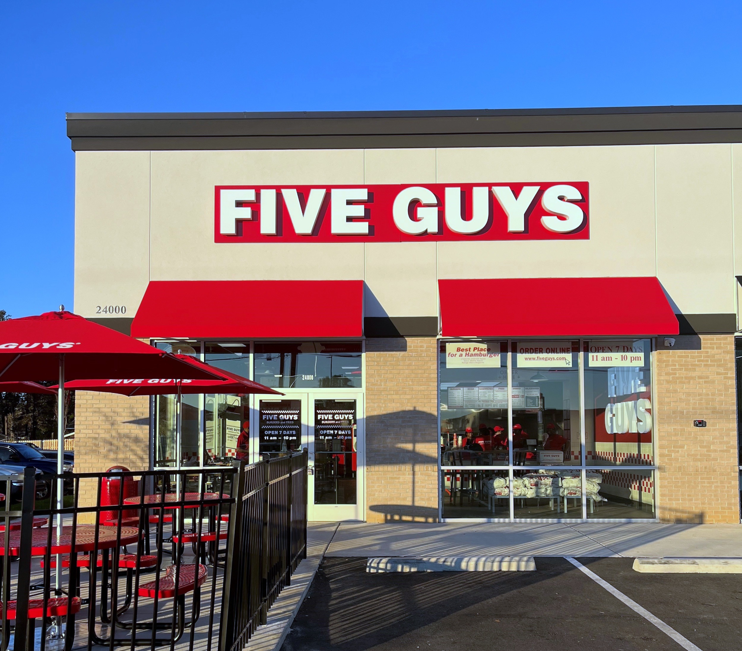 Exterior photograph of the Five Guys restaurant at 23992 US Highway 80 East in Statesboro, Georgia.