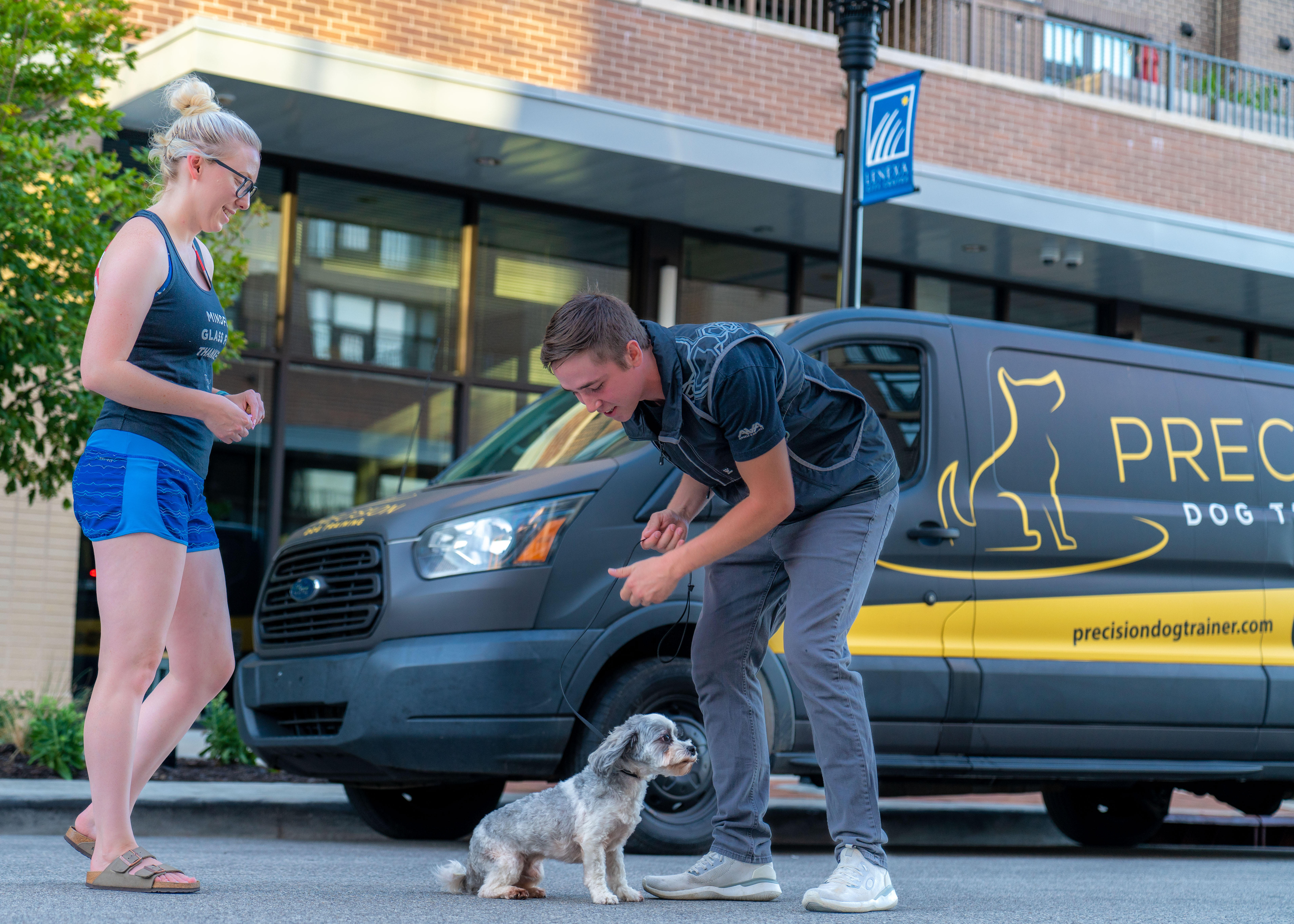 Dog trainer with a small dog