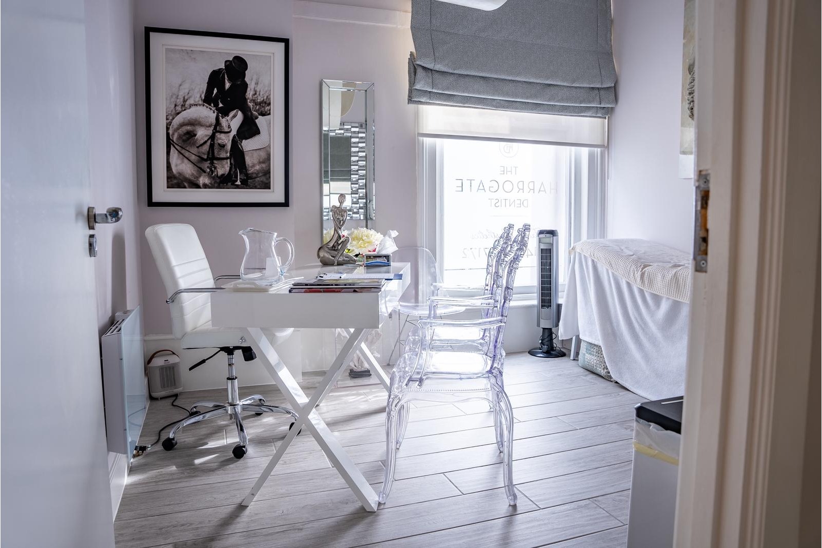 Elegant private consultation room at The Harrogate Clinic with a stylish desk, designer seating, and natural light, where patients discuss treatment plans with the clinic's dental and aesthetic specialists in Harrogate.