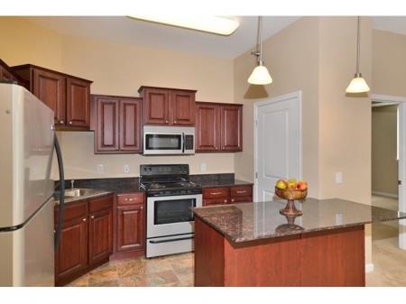 kitchen with a center island and a stove top oven 