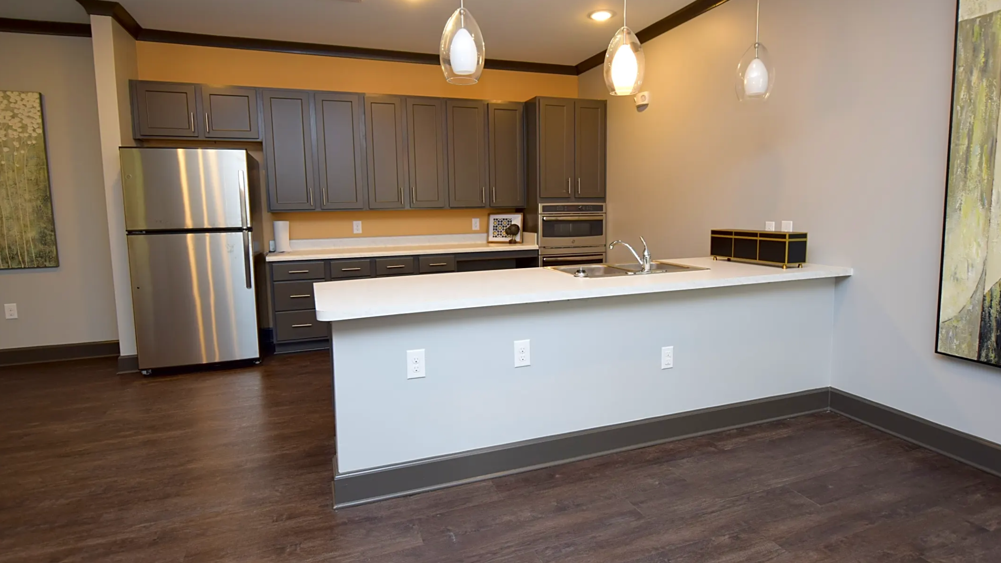 Open concept kitchen with breakfast bar, granite countertops and stainless steel appliances.