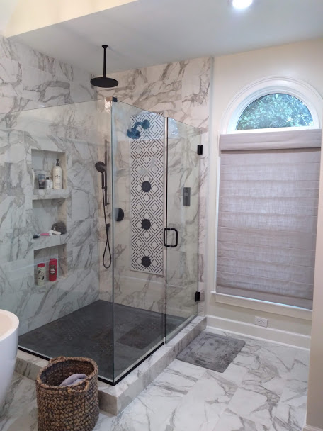 This beautiful custom bathroom gives us the chills! There are all shades of grey from the bathroom tile to the marble floor. Roman Shades that are grey flecked with silver are the perfect element for privacy while bringing a layer of glam!
Looking to add a special design element to your project?