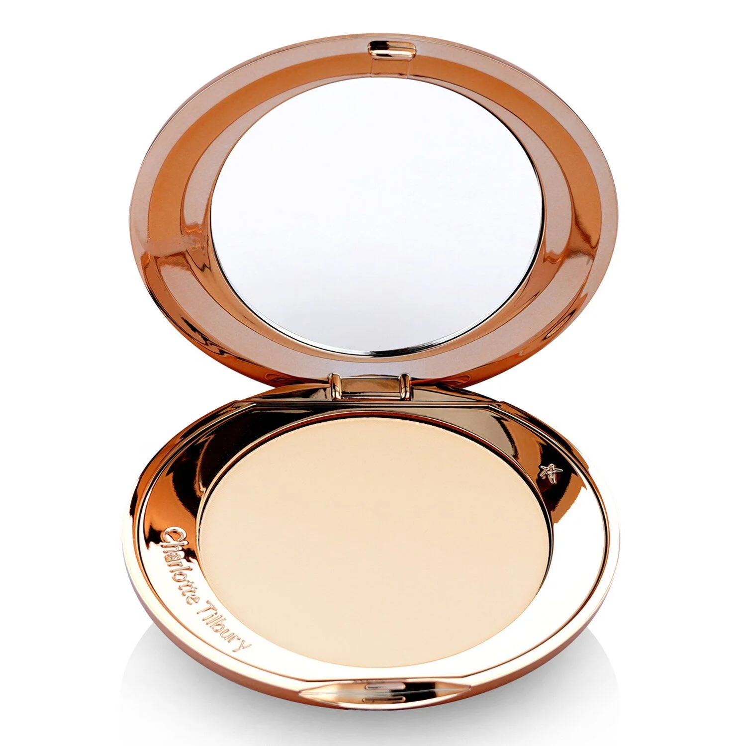 A rose gold compact powder with an open lid revealing a mirror and the powder. The brand name 'Charlotte Tilbury' is embossed on the side of the compact.