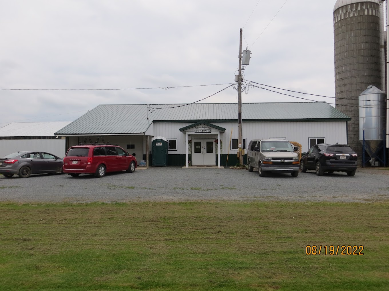 Rainbow Reflections Discount Groceries Logo