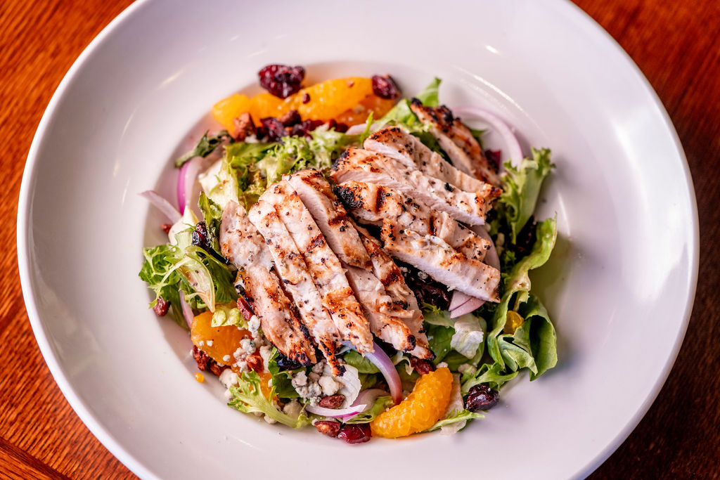lettuce blend, cranberries, mandarin oranges, red onion, candied spiced pecans, blue cheese, orange-cranberry splash dressing, grilled chicken