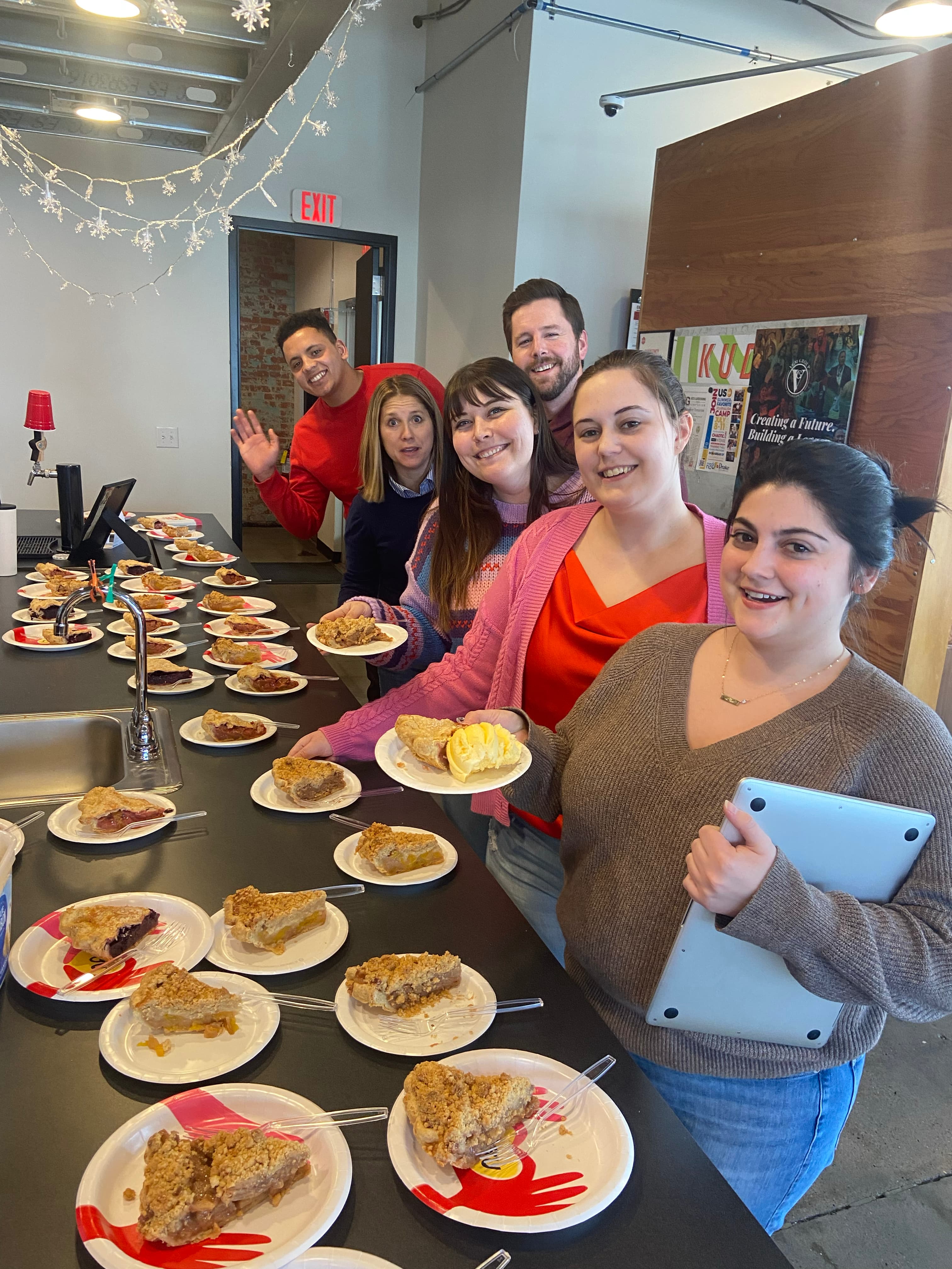 The culture team at Two Rivers Marketing sharing breakfast with all associates in the kitchen area and break room.
