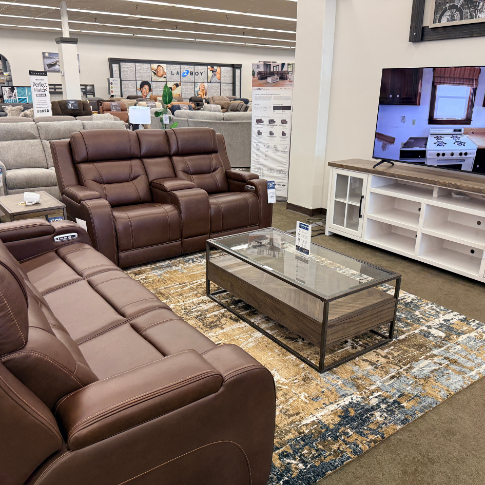 Black Midnight Madness sectional with chaise displayed at Slumberland Furniture Burlington in Burlington, Iowa.