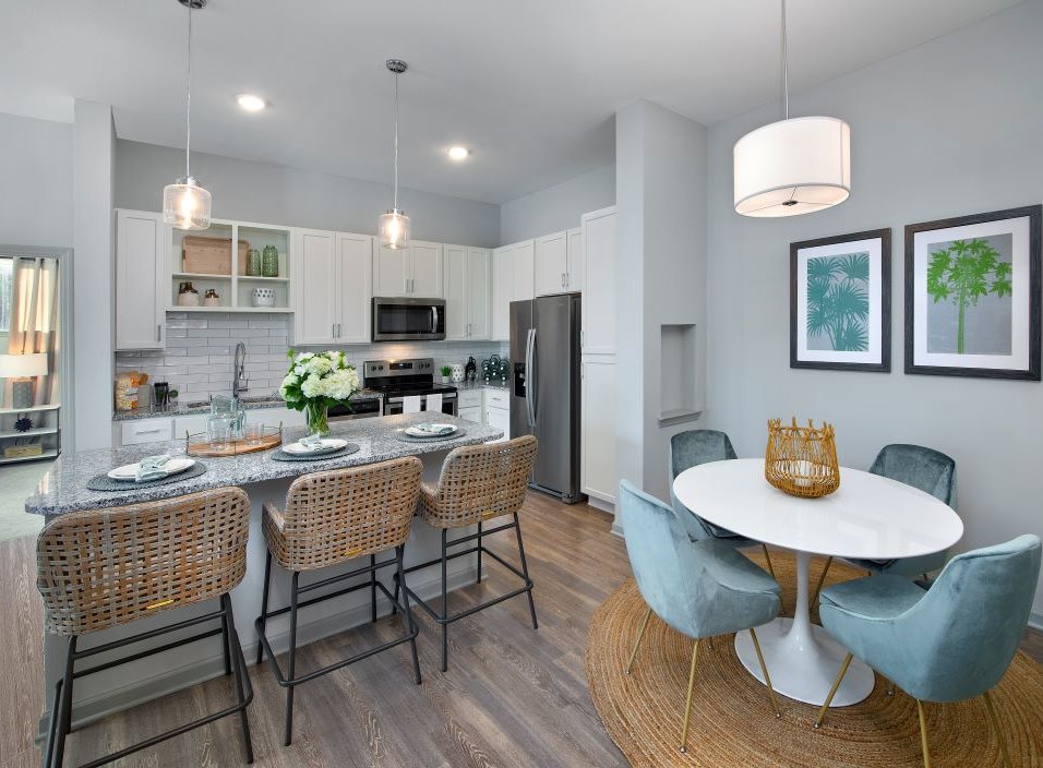 Gorgeous Dining Room Space with Wood Plank Vinyl Flooring (in Select Units) at The Edison Apartments in Fort Myers