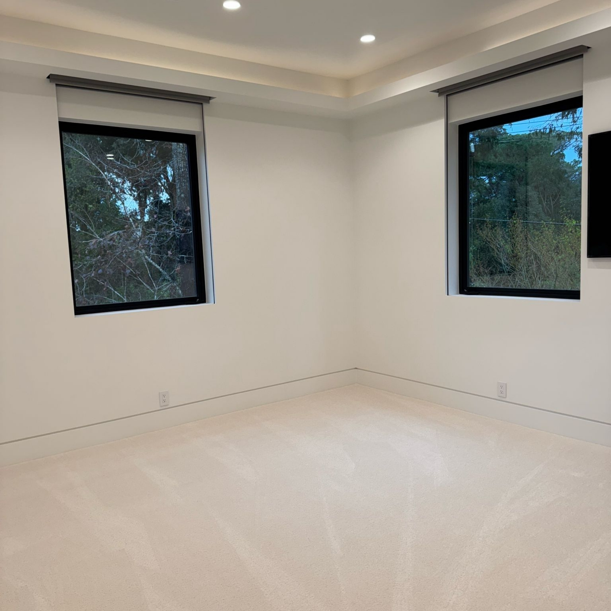 Bright and airy room with large windows.