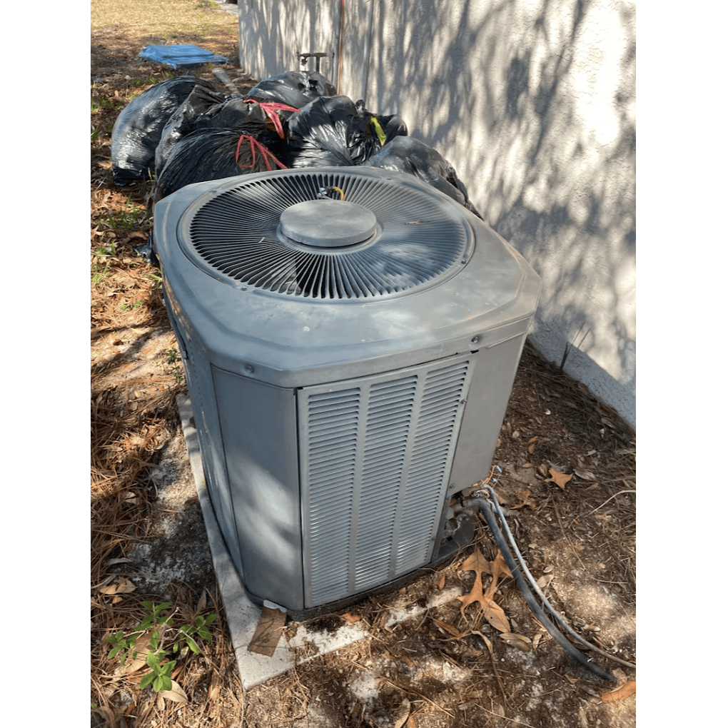 Older outdoor air conditioning unit needing repair or replacement for residential HVAC system by Gotcha Heating and Air Inc in Spring Hill Florida