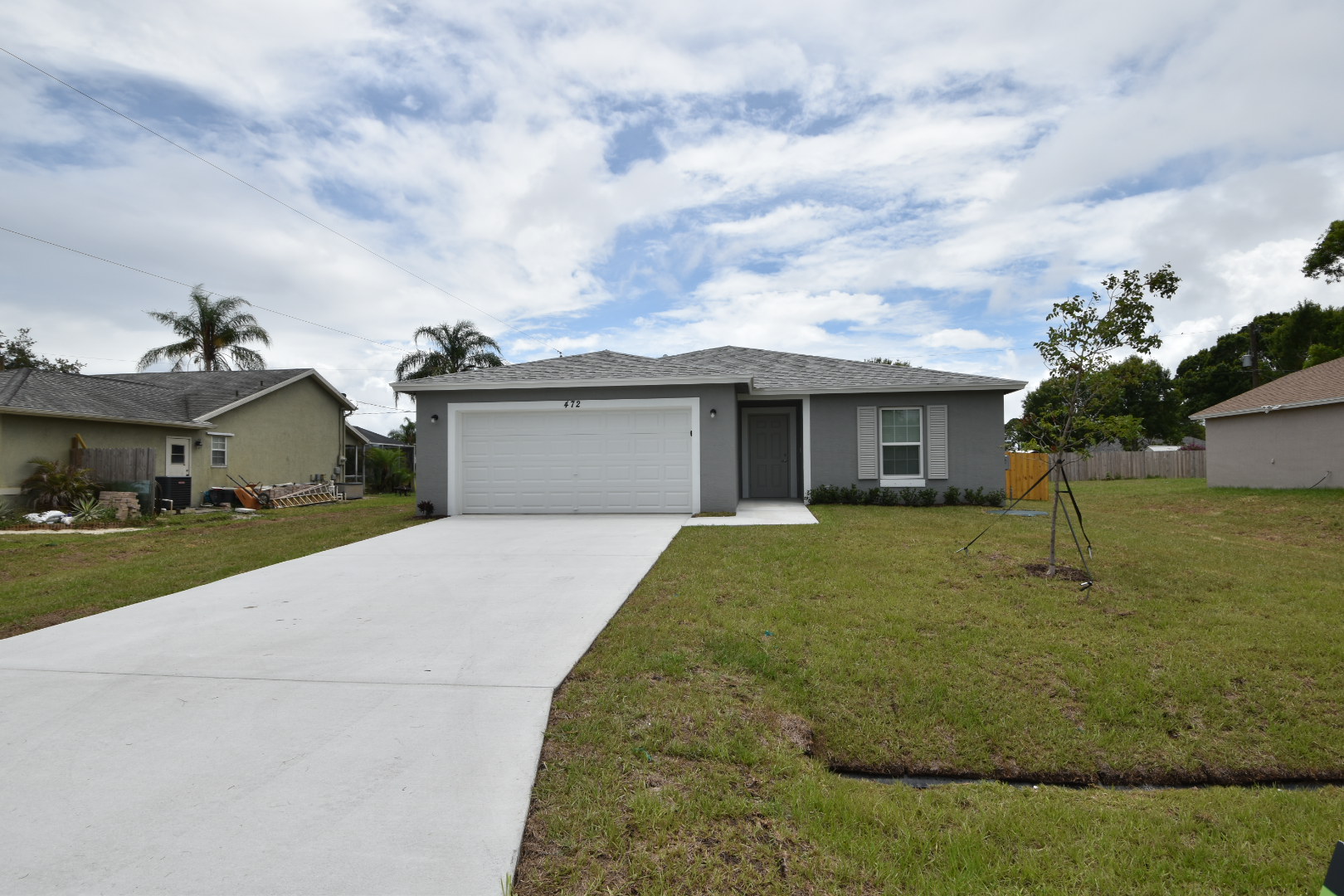 Charming home with extended driveway at Invitation Homes South Florida.