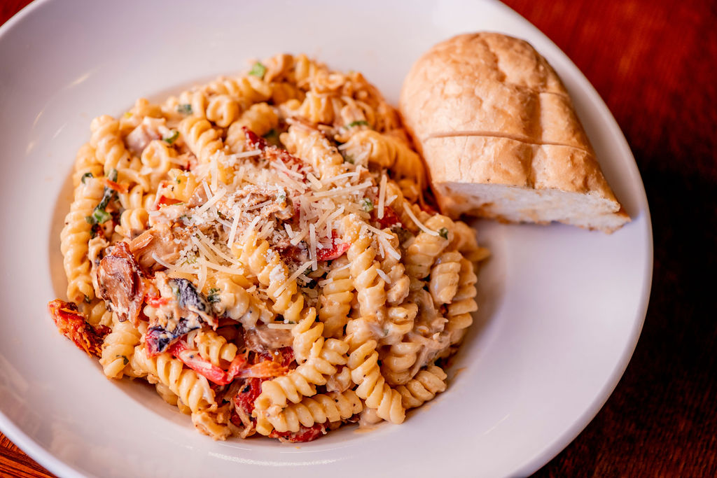blackened chicken, bacon, red peppers, green onions, sun-dried tomatoes, mushrooms, smoked gouda sauce, rotini pasta, shaved parmesan