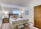 A beautifully designed model apartment bedroom at One Lincoln Park, showcasing spacious and comfortable independent senior living in Dayton, OH.