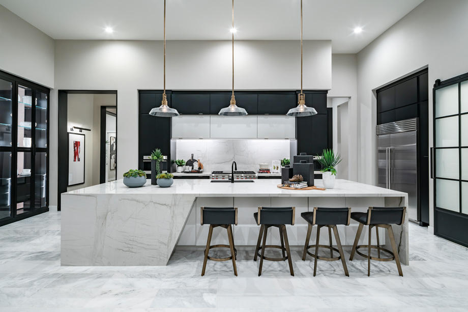 Gourmet kitchens with oversized islands and stainless steel Wolf appliances