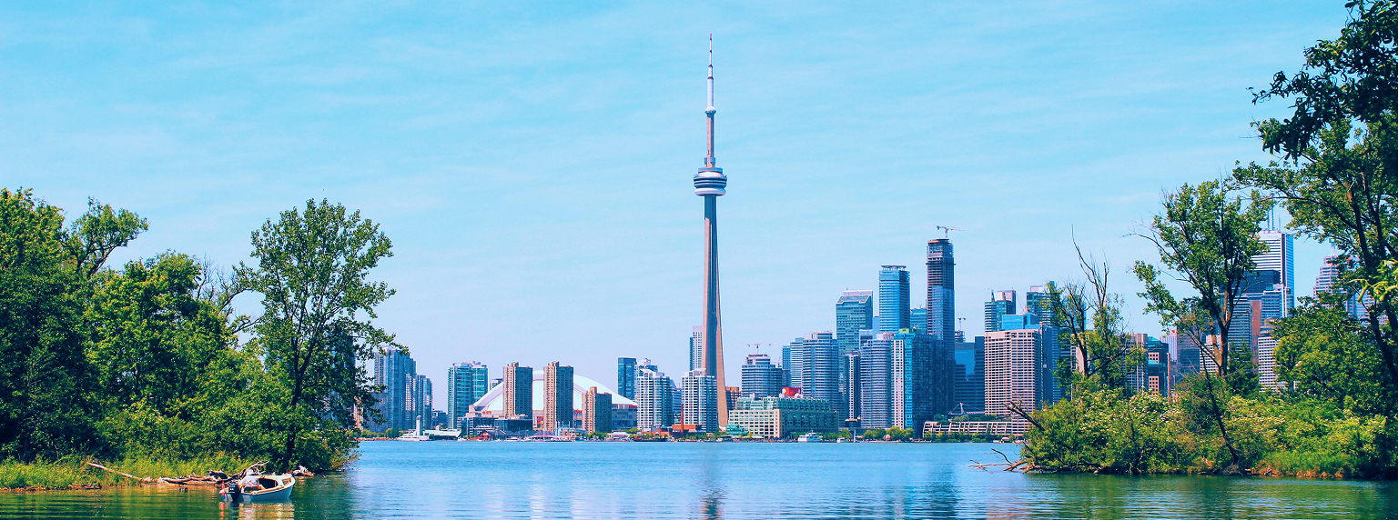 View of the Toronto skyline from across the lake at the Toronto Islands.