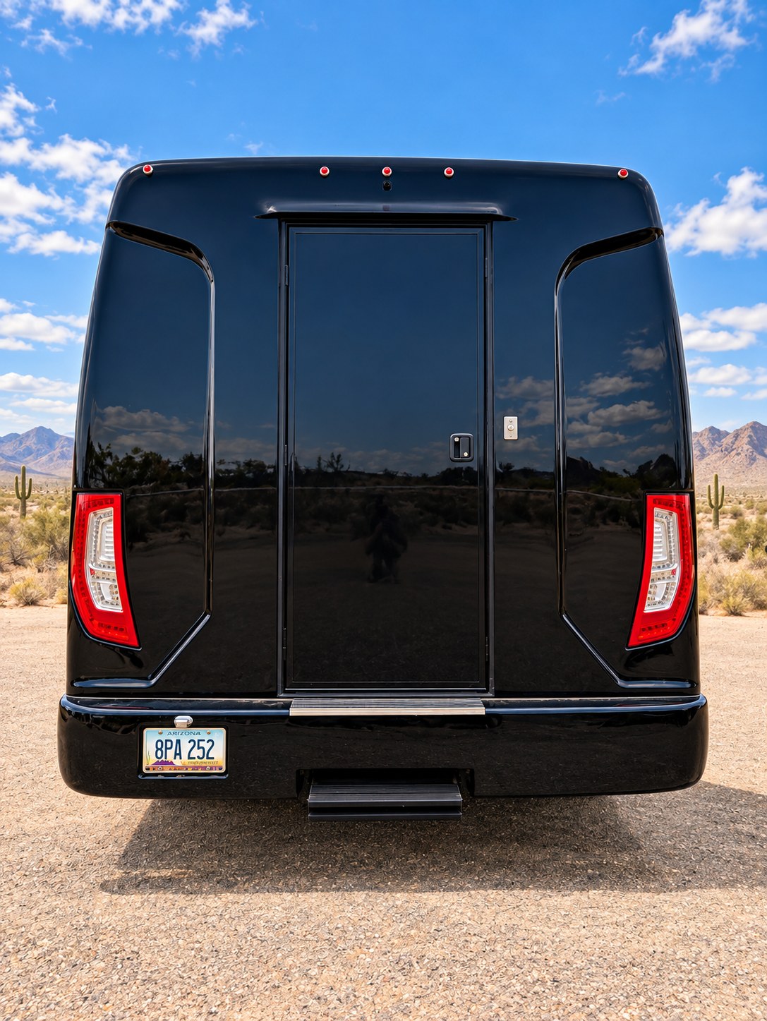 Rear view of a black executive passenger shuttle.