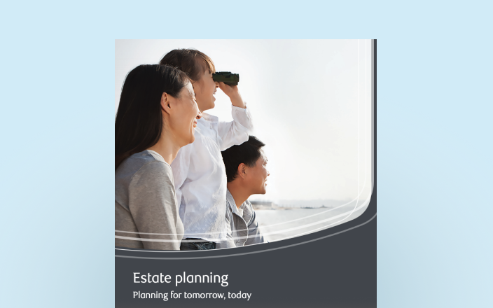 Cover of the estate planning guide with a family using binoculars as they overlook a body of water.