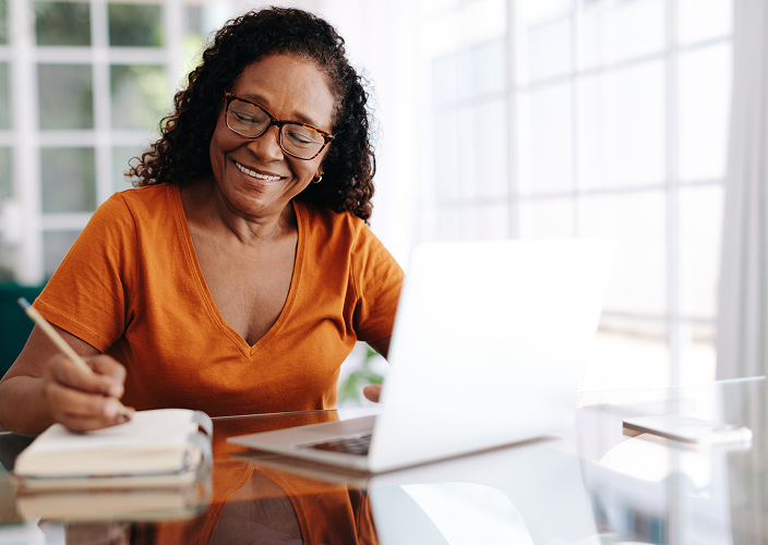 A client reviewing their bank account on their laptop.