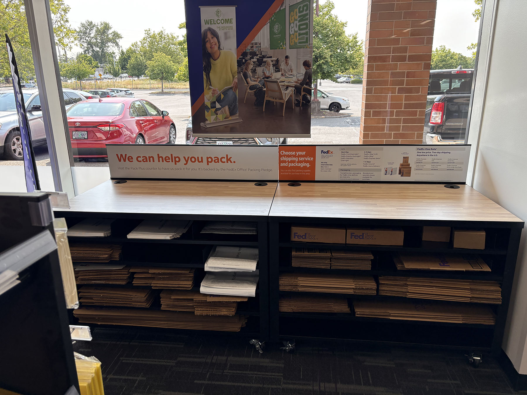 Packing Table and Shipping Supplies &ndash; Work table with boxes and packing materials used for preparing shipments at FedEx Office.