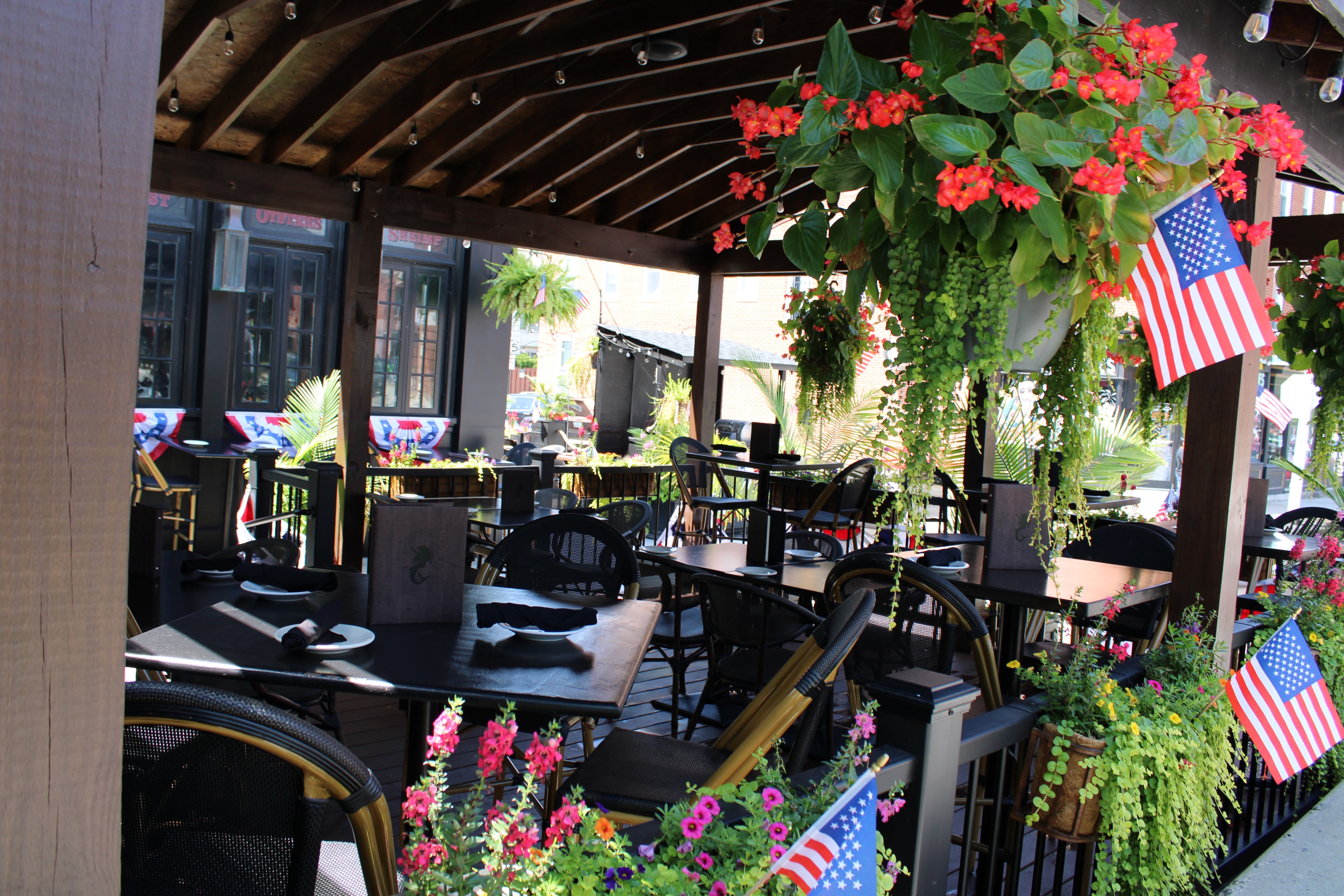 Mama's On The Half Shell Baltimore Outdoor Dining Area dressed in American flags for Fourth of July 