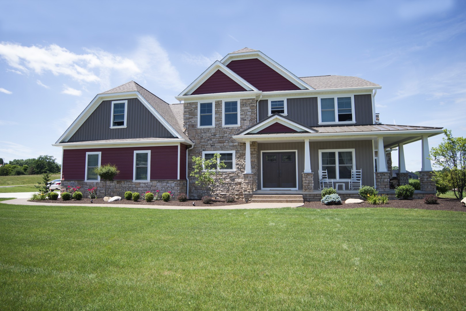 The EcoTek 1200 - 2200 Series Windows elevate this home's exterior with their crisp, clean lines and energy-efficient design. These windows seamlessly complement the mixed stone and siding facade, adding to the home's stylish and modern appeal while providing enhanced functionality and efficiency.