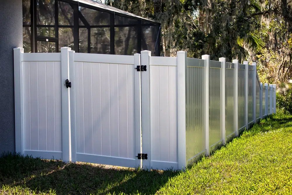 painted white wooden privacy fence with gate by Pro-Line Fence Co.