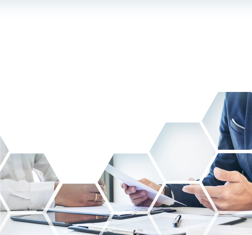 Close up shot of two people reviewing and discussing documents.