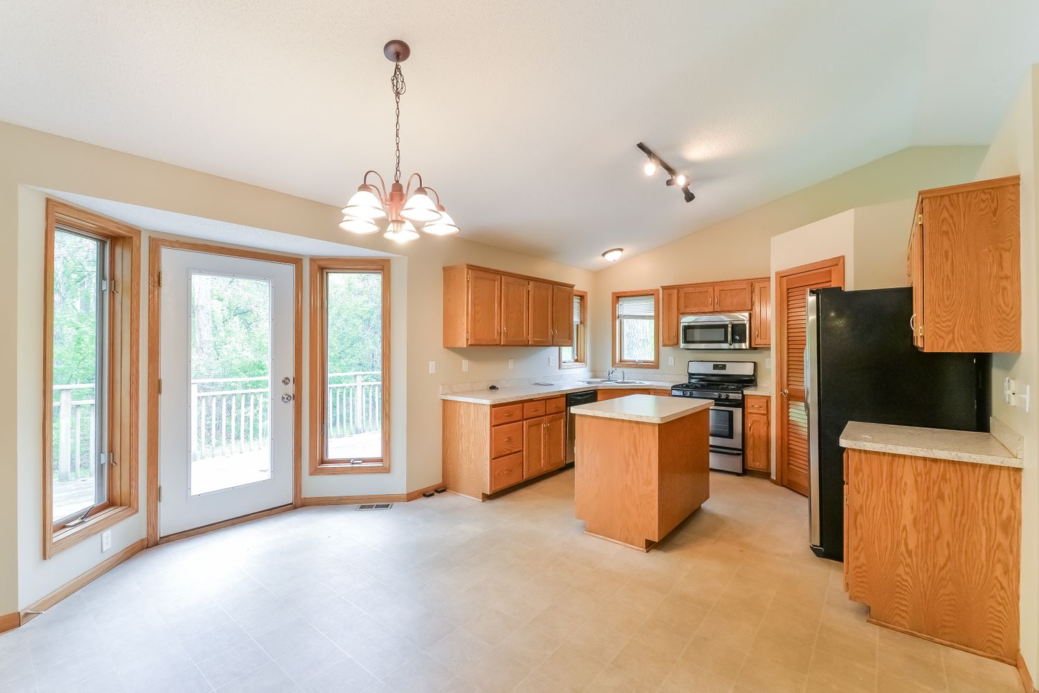 Beautiful kitchen with easy access to dining and the backyard at Invitation Homes Minneapolis.