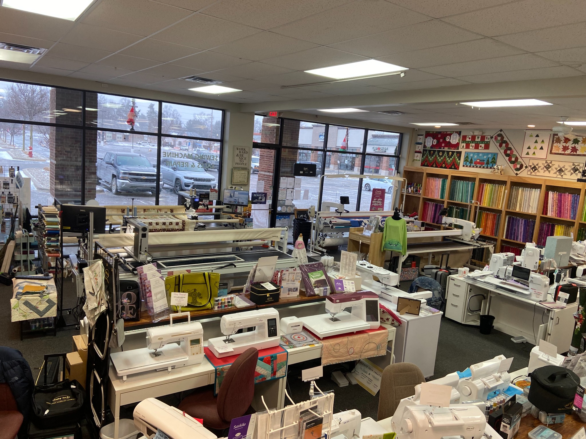 Explore Decorative Stitch's spacious sewing and quilting showroom featuring premium sewing machines, longarm quilting systems, vibrant fabric collections, quilting supplies, and expert services for every skill level.