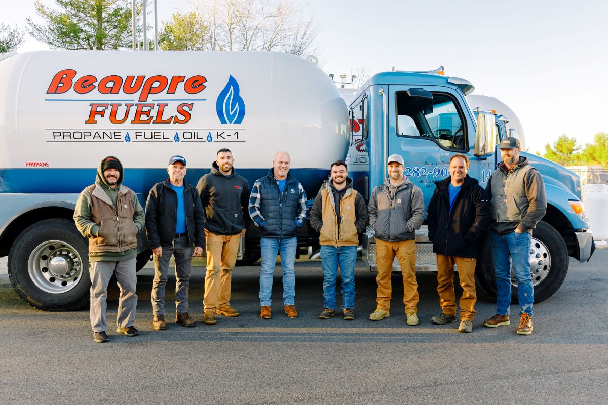 The Beaupre Fuels delivery and service team standing in front of a company fuel truck in Southern Maine. Beaupre Fuels provides reliable propane delivery, heating oil delivery, HVAC services, and residential and commercial heating solutions throughout Biddeford and surrounding communities.