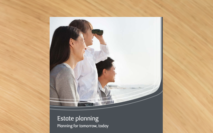 Cover of the estate planning guide with a family using binoculars as they overlook a body of water.