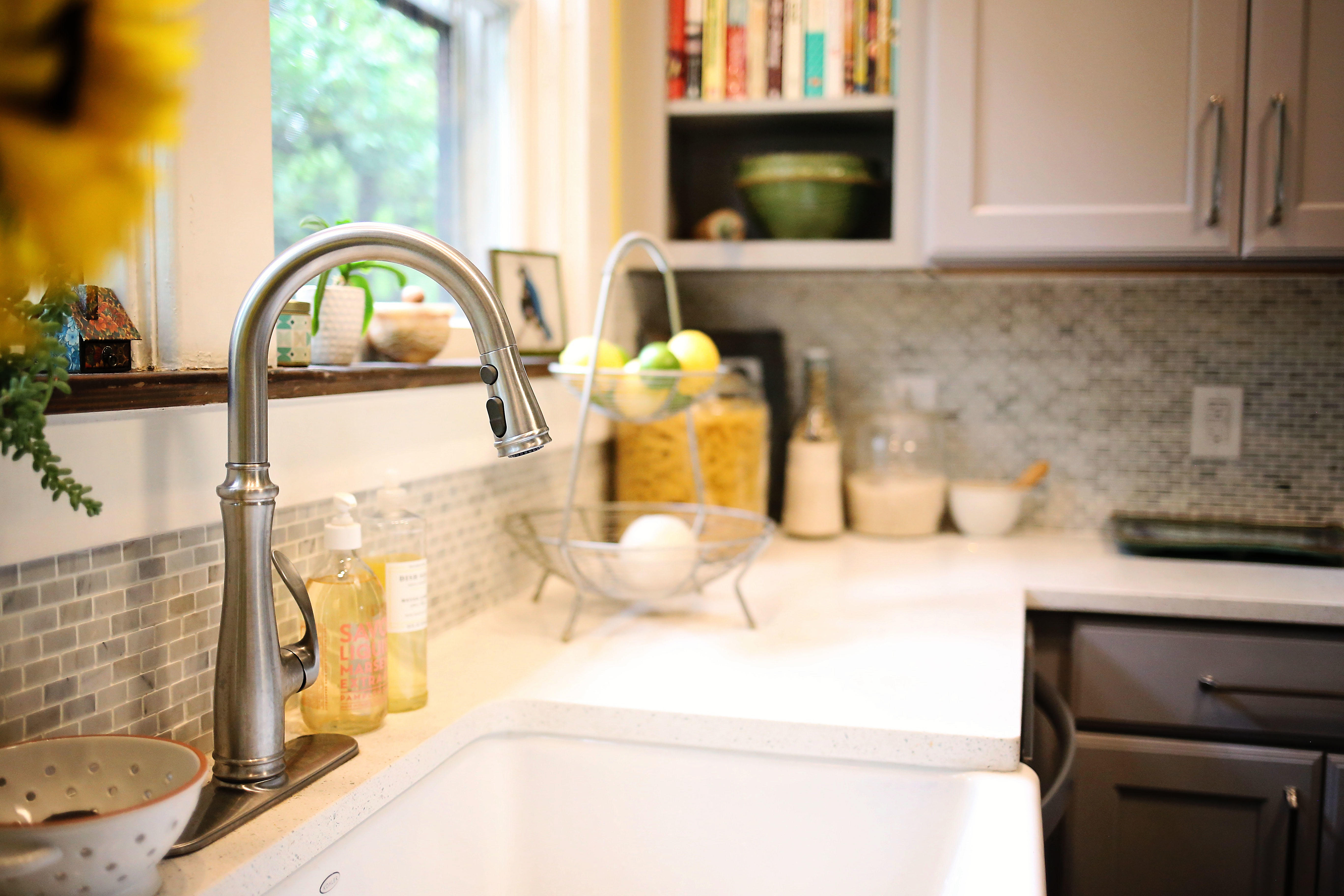 A kitchen faucet eye view of the sink and kitchen countertop landing area next to it emphasize how important it is to design a sink work area that has enough room to handle your every day kitchen activities.