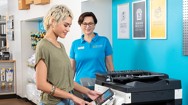 store associate creating copies at the ups store