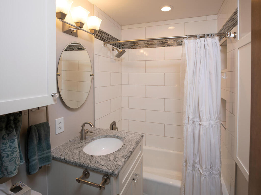 ZimmTown Construction’s bathroom remodel features sleek fixtures, elegant tilework, and modern lighting. A spacious vanity, custom storage, and a beautifully tiled shower create a stylish and functional retreat designed for comfort and relaxation.