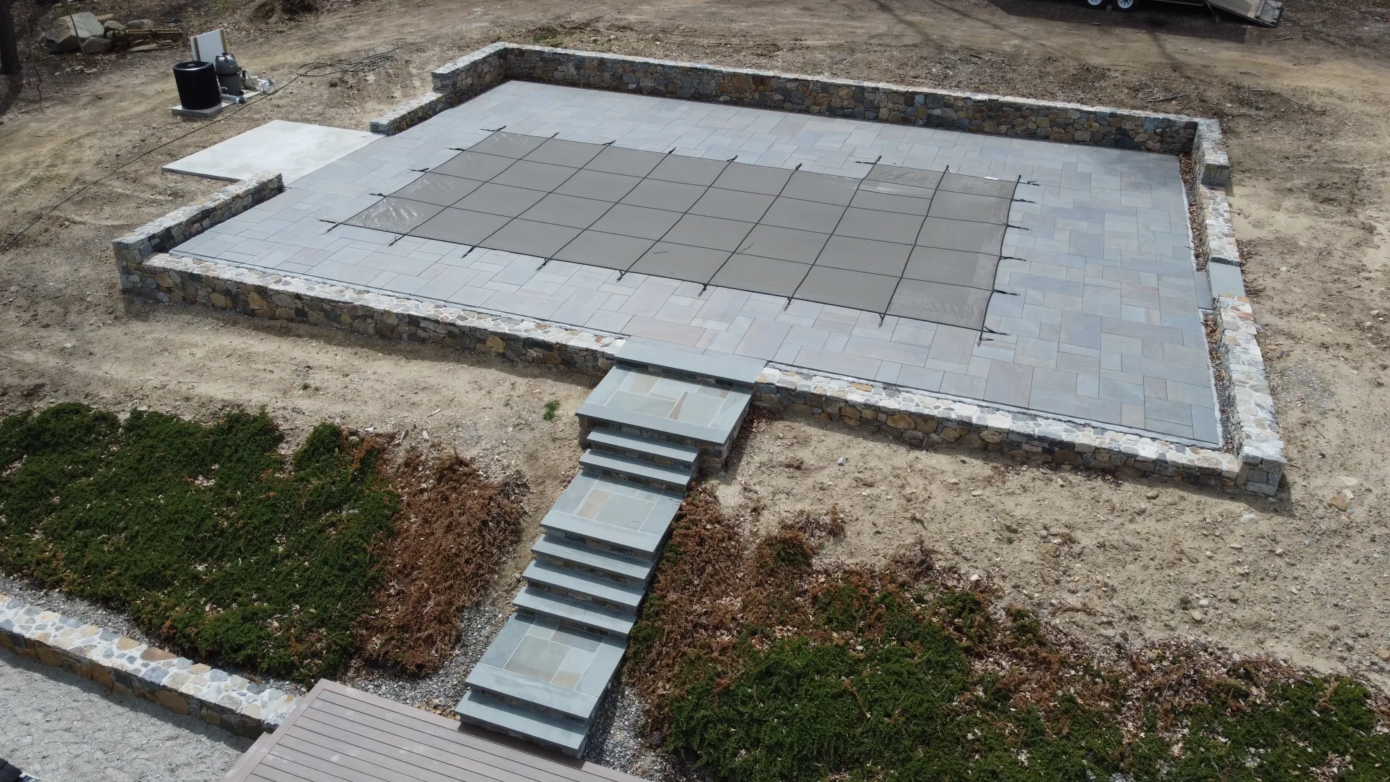Drone view of a completed pool deck project in Bethany - Paver Pool Deck, Bethany project by General Masonry LLC.
