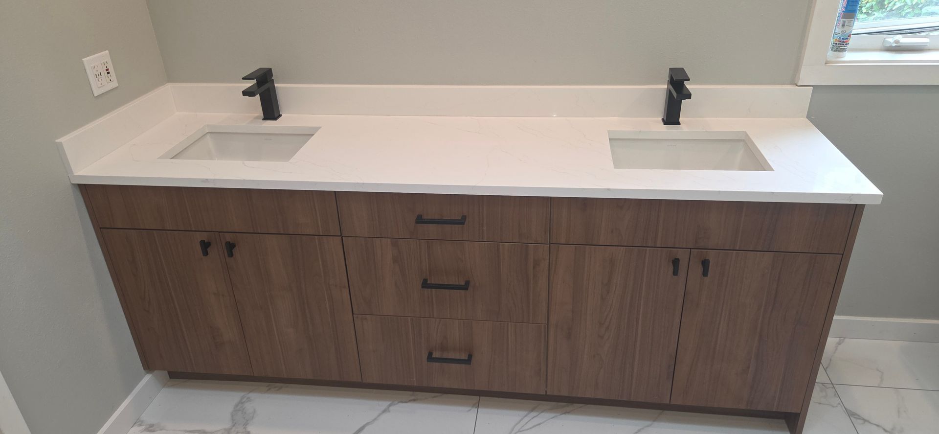 Modern double bathroom vanity featuring a white quartz countertop, two rectangular undermount sinks, 