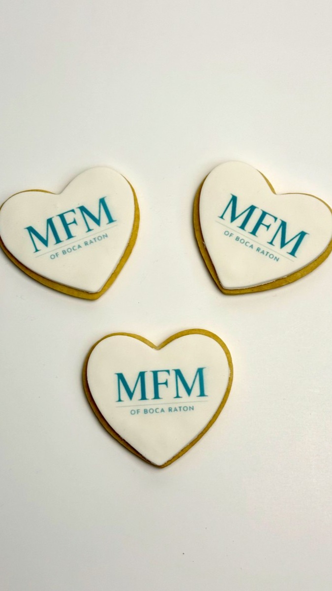 Logo cookies and corporate catering desserts. 