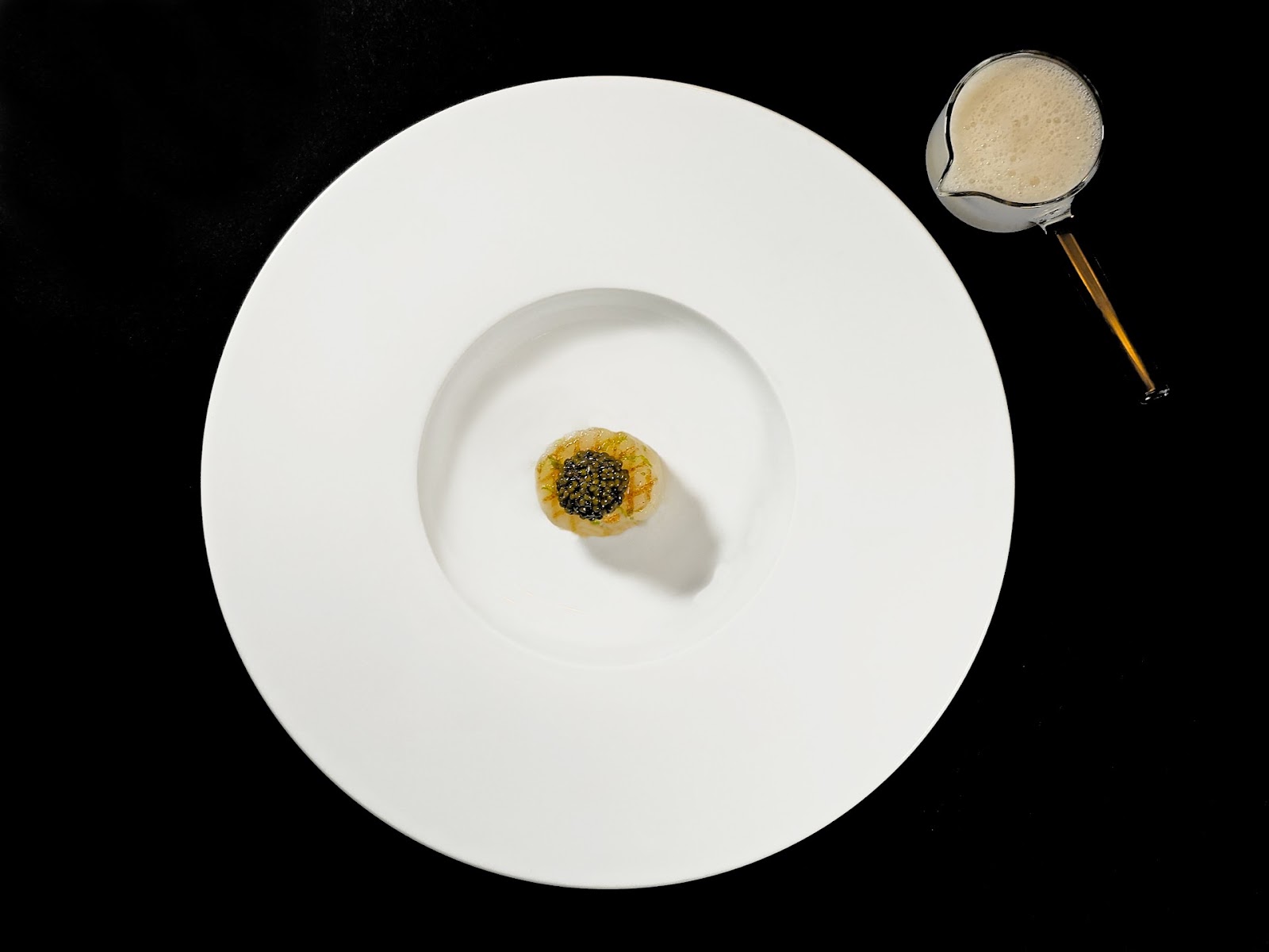Scallop, a dish at Essential by Christophe. Served in the dining room on Manhattan's Upper West Side, near Lincoln Center.