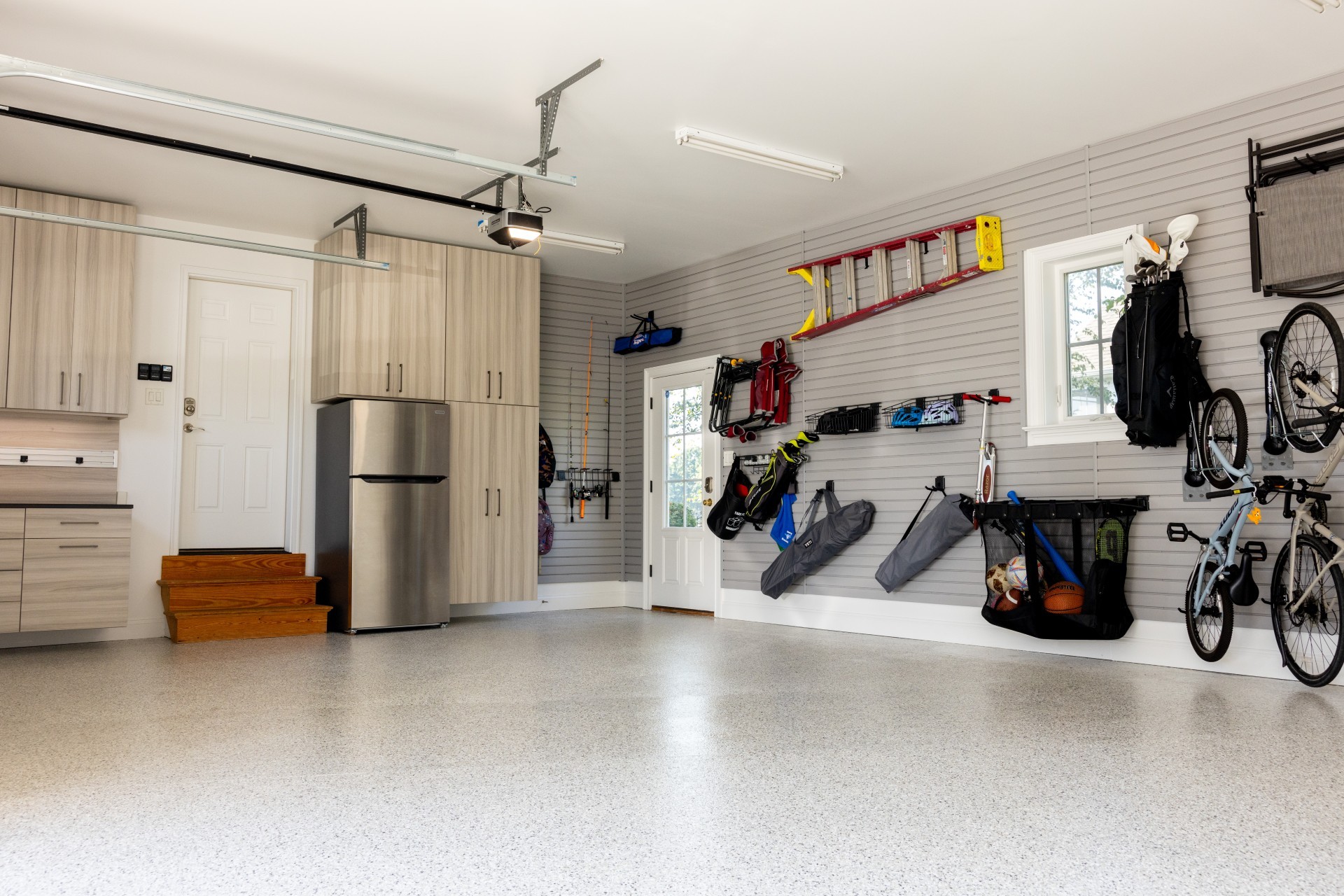 Is there anything better than a well-organized garage? We don't think so. This Lancaster family needed a space that did it all... and more. The custom workbench with lighting, pantry-style cabinets, abundant slatwall, and durable epoxy floor keeps them neat and stress-free!