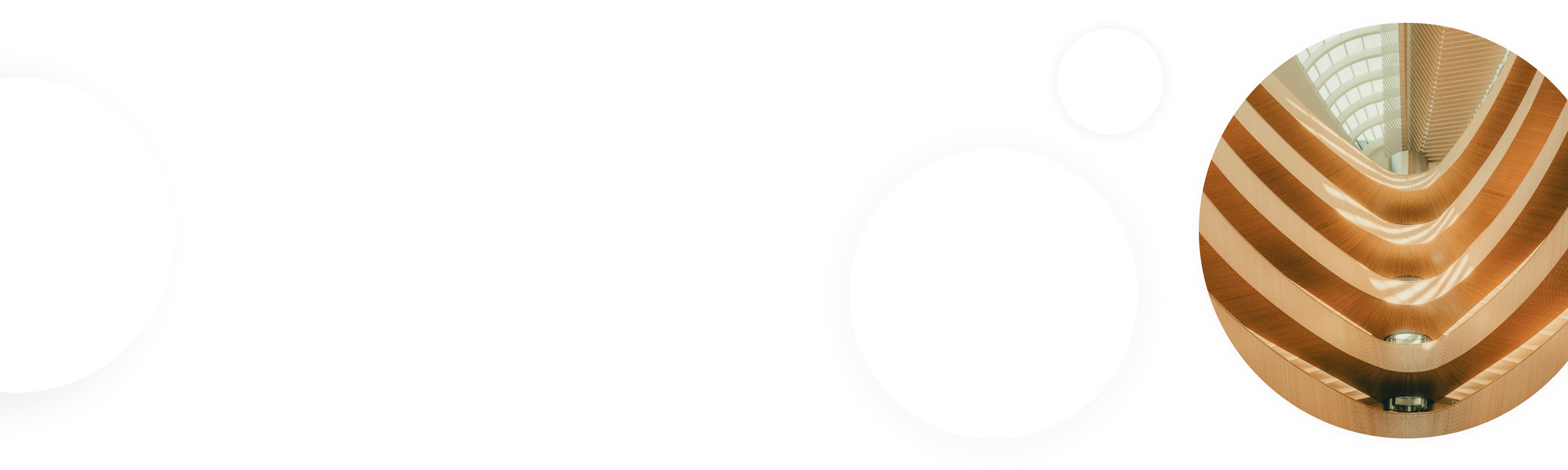 Architectural interior of a library's interior, looking up at a skylight.