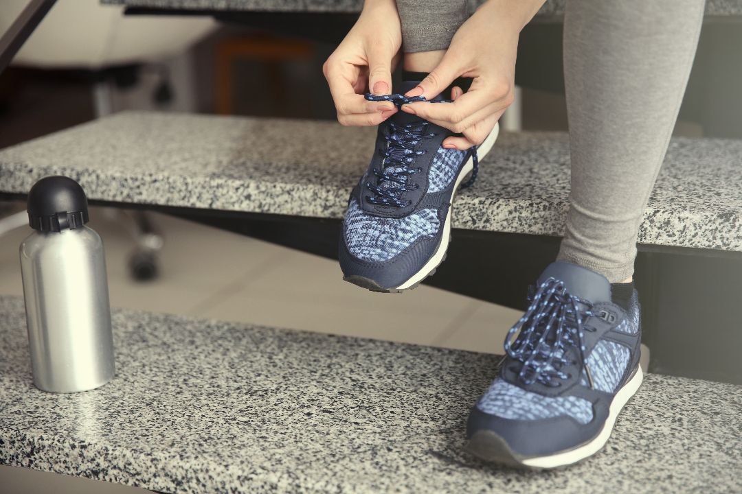 woman tying athletic shoes.jpg