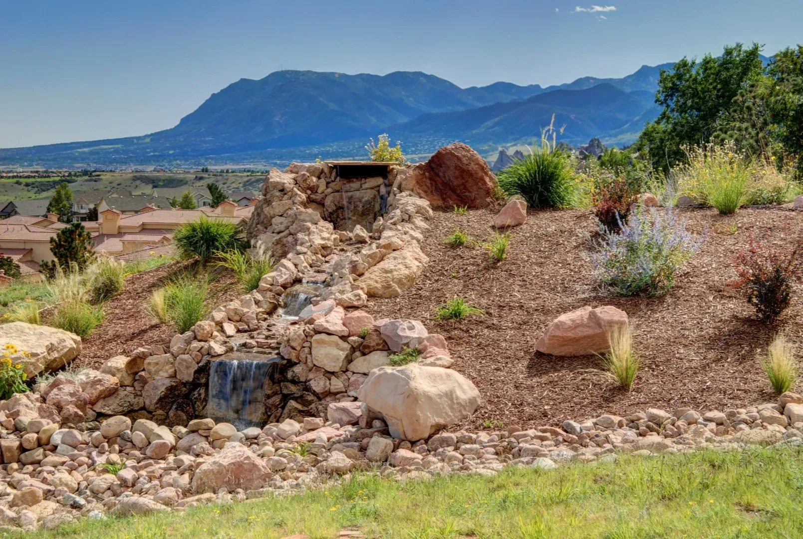 Bring movement, sound, and a peaceful focal point to your landscape with a custom water feature. Fro 
